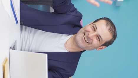 Vertical-video-of-Cheerful-and-happy-happy-businessman-waving-at-camera.